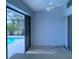 Screened lanai with view of a pool and mature trees in the backyard at 2178 Calcutta Rd, Punta Gorda, FL 33983