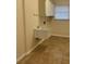 Functional laundry room with a utility sink, cabinet and window allowing plenty of light at 2178 Calcutta Rd, Punta Gorda, FL 33983