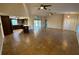 Open-concept living area with tile flooring, kitchen bar, and sliding doors at 2178 Calcutta Rd, Punta Gorda, FL 33983