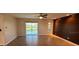 Open living room boasting tile floors, an accent wall and sliding glass doors overlooking the pool at 2178 Calcutta Rd, Punta Gorda, FL 33983