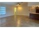 Bright living space with tile flooring, ceiling fan, and plenty of natural light at 2178 Calcutta Rd, Punta Gorda, FL 33983