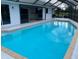 The private screened-in swimming pool has an adjacent slider door for easy access at 2178 Calcutta Rd, Punta Gorda, FL 33983