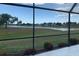 Screened-in lanai offers a beautiful view of the lake and neighborhood beyond at 2178 Calcutta Rd, Punta Gorda, FL 33983
