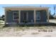 Newly constructed one-story home featuring a covered front porch and natural light from the windows at 2206 53Rd E Ave, Bradenton, FL 34203