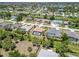 Aerial view of home showcasing houses, a waterfront community with canals, and green landscaping at 251 Broadmoor Ln, Rotonda West, FL 33947