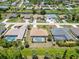 An eye-catching aerial view showcasing homes, inviting pools, and canal-front properties at 251 Broadmoor Ln, Rotonda West, FL 33947