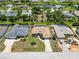 An aerial view of the property highlighting the pool and landscaping at 251 Broadmoor Ln, Rotonda West, FL 33947