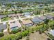 A picturesque aerial view of a charming neighborhood with homes, pools, and waterfront access at 251 Broadmoor Ln, Rotonda West, FL 33947