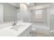 Bright bathroom features a new vanity and shower over tub at 251 Broadmoor Ln, Rotonda West, FL 33947