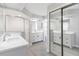 Bright bathroom featuring dual sinks, modern fixtures and a step-in shower at 251 Broadmoor Ln, Rotonda West, FL 33947