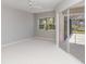 Spacious bedroom with natural light, leading to a screened lanai at 251 Broadmoor Ln, Rotonda West, FL 33947