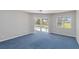 Bright bedroom with a ceiling fan and sliding door leading to a screened pool area at 251 Broadmoor Ln, Rotonda West, FL 33947