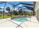 This in-ground pool is screened-in with steps for easy access at 251 Broadmoor Ln, Rotonda West, FL 33947
