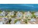 A birds eye view shows the community of waterfront homes with a tranquil bay in the background at 276 Saint Lucia Dr # 101, Bradenton, FL 34209
