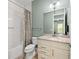 Clean bathroom featuring a shower-tub combo, light countertops, and a large mirror at 276 Saint Lucia Dr # 101, Bradenton, FL 34209