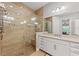 Bright bathroom featuring a spacious glass shower, double vanity and granite countertops at 276 Saint Lucia Dr # 101, Bradenton, FL 34209
