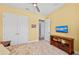 Relaxing bedroom features neutral colors, a ceiling fan, and closet at 276 Saint Lucia Dr # 101, Bradenton, FL 34209