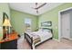 Well lit bedroom with a ceiling fan and large window at 276 Saint Lucia Dr # 101, Bradenton, FL 34209