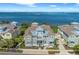 Beautiful two-story waterfront home featuring lush landscaping and a welcoming front porch at 276 Saint Lucia Dr # 101, Bradenton, FL 34209