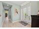 Bright foyer showcasing neutral walls and floors, a decorative painting, and a glass-paned front door at 276 Saint Lucia Dr # 101, Bradenton, FL 34209
