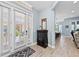 Bright foyer with natural light, stylish decor, and wood look tiled flooring at 276 Saint Lucia Dr # 101, Bradenton, FL 34209