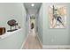 Hallway boasting hard wood floors and stylish decorative artwork at 276 Saint Lucia Dr # 101, Bradenton, FL 34209