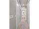 Neutral hallway featuring tile floors, white doors and trim, and recessed lighting at 276 Saint Lucia Dr # 101, Bradenton, FL 34209