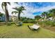 Relaxing hammocks nestled among palm trees and lush landscaping, creating a serene and inviting outdoor space at 276 Saint Lucia Dr # 101, Bradenton, FL 34209