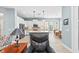 The kitchen has stainless steel appliances, pendant lights, and an island with stools at 276 Saint Lucia Dr # 101, Bradenton, FL 34209