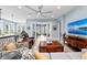 Spacious living room with hardwood floors, ceiling fan, and a view of the backyard at 276 Saint Lucia Dr # 101, Bradenton, FL 34209