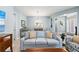 Cozy living room features a comfortable sofa with throw pillows and a view into the dining area at 276 Saint Lucia Dr # 101, Bradenton, FL 34209