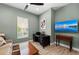 Comfortable living room features a mounted TV and desk for convenience at 276 Saint Lucia Dr # 101, Bradenton, FL 34209