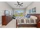 Comfortable bedroom featuring a coastal view from the large window and wooden furnishings, all illuminated by natural light at 276 Saint Lucia Dr # 101, Bradenton, FL 34209