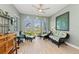 Comfortable sitting area with wicker furniture and scenic water views from the room's many windows at 276 Saint Lucia Dr # 101, Bradenton, FL 34209