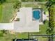 Overhead view of home showcasing the roof, screened pool, and manicured landscaping around the property at 2801 Dalhart Ave, North Port, FL 34286