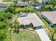 Aerial view of a single-Gathering home with a screened-in pool and well maintained lawn at 2801 Dalhart Ave, North Port, FL 34286