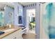 Bathroom with a view through the doorway to a dining room at 2801 Dalhart Ave, North Port, FL 34286