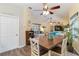 Open-concept dining area with wood table, seamlessly connects to the living space at 2801 Dalhart Ave, North Port, FL 34286
