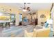 Spacious living area featuring an open floor plan and views of the outdoor pool at 2801 Dalhart Ave, North Port, FL 34286