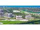 Beautiful aerial view of waterfront condo community nestled between a golf course and a serene waterway at 3070 Grand Bay Blvd # 644, Longboat Key, FL 34228