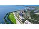Stunning aerial view of a waterfront condo community with lush golf course and glistening bay views at 3070 Grand Bay Blvd # 644, Longboat Key, FL 34228