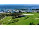 Breathtaking aerial view of the golf course and marina with stunning waterfront scenery at 3070 Grand Bay Blvd # 644, Longboat Key, FL 34228