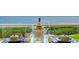 Balcony table setting with waterfront views, great for enjoying outdoor meals with stunning scenery at 3070 Grand Bay Blvd # 644, Longboat Key, FL 34228