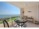 Balcony dining area, overlooking water and golf course, perfect for relaxing with a beautiful view at 3070 Grand Bay Blvd # 644, Longboat Key, FL 34228