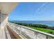 Expansive balcony view overlooking the golf course and beautiful ocean, providing a serene outdoor space at 3070 Grand Bay Blvd # 644, Longboat Key, FL 34228