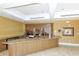 Elegant bar area with granite countertops and custom cabinetry with a sophisticated design at 3070 Grand Bay Blvd # 644, Longboat Key, FL 34228