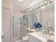 Bathroom featuring a glass-enclosed shower, tile flooring, vanity and toilet for a clean and modern design at 3070 Grand Bay Blvd # 644, Longboat Key, FL 34228