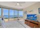 Spacious bedroom with large windows offering stunning water views and balcony access at 3070 Grand Bay Blvd # 644, Longboat Key, FL 34228