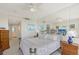 Spacious bedroom with mirrored wall and large windows offering water views at 3070 Grand Bay Blvd # 644, Longboat Key, FL 34228