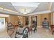 Well decorated sitting area inside the clubhouse with comfortable chairs, tile floors and layered ceilings at 3070 Grand Bay Blvd # 644, Longboat Key, FL 34228